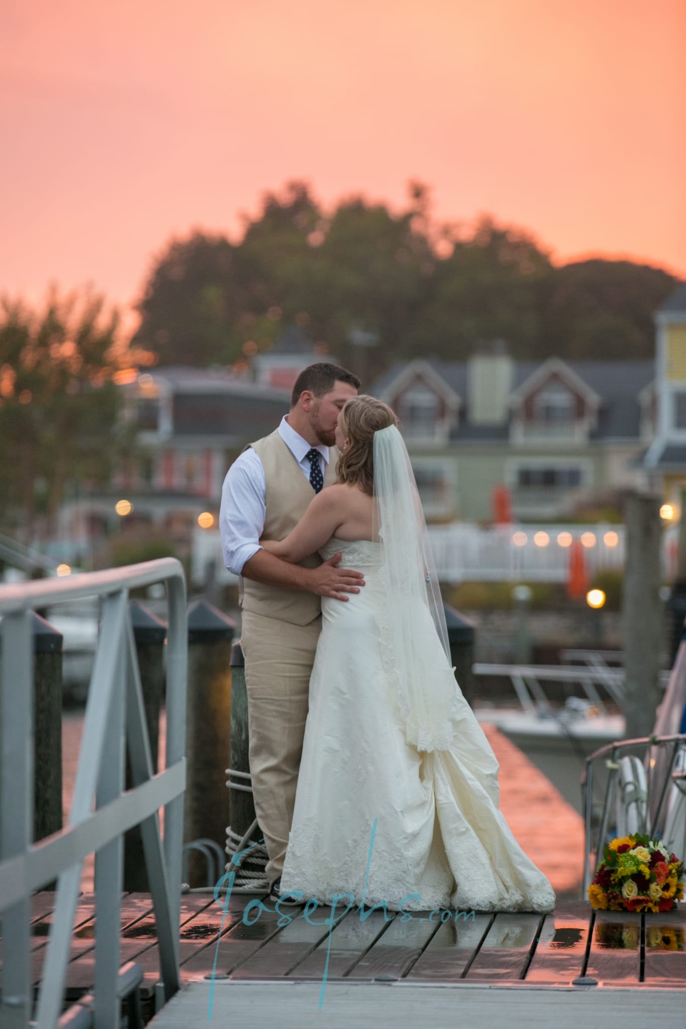 Bride and Groom Kissing at Sunset (2)