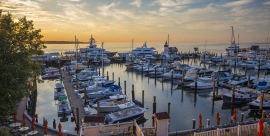 Sunrise over a marina full of boats