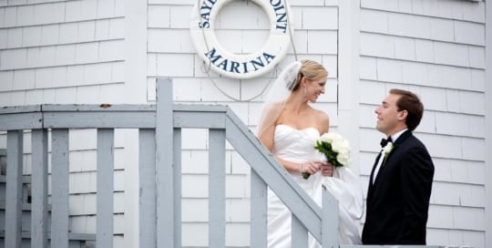Bridal couple together at Connecticut lighthouse.