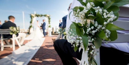 Wedding flowers on ceremony seating.