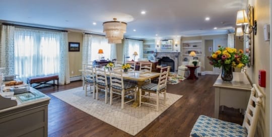 Open concept dining and living room in guest house.