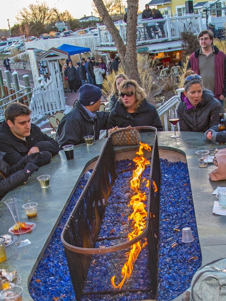 marina-bar-3 Chilly Patrons At The Marina Bar Around A Fireplace With Cocktails