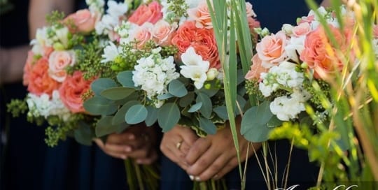 Bridesmaids holding flowers.